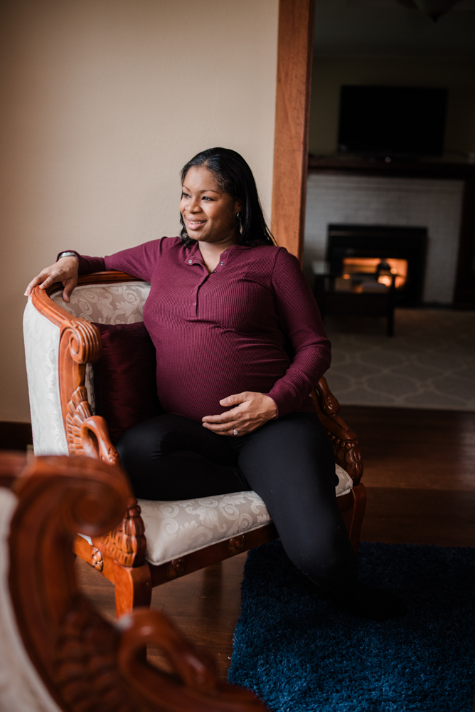 cozy in-home maternity photo by fireplace, lifestyle newborn photographer Tacoma WA