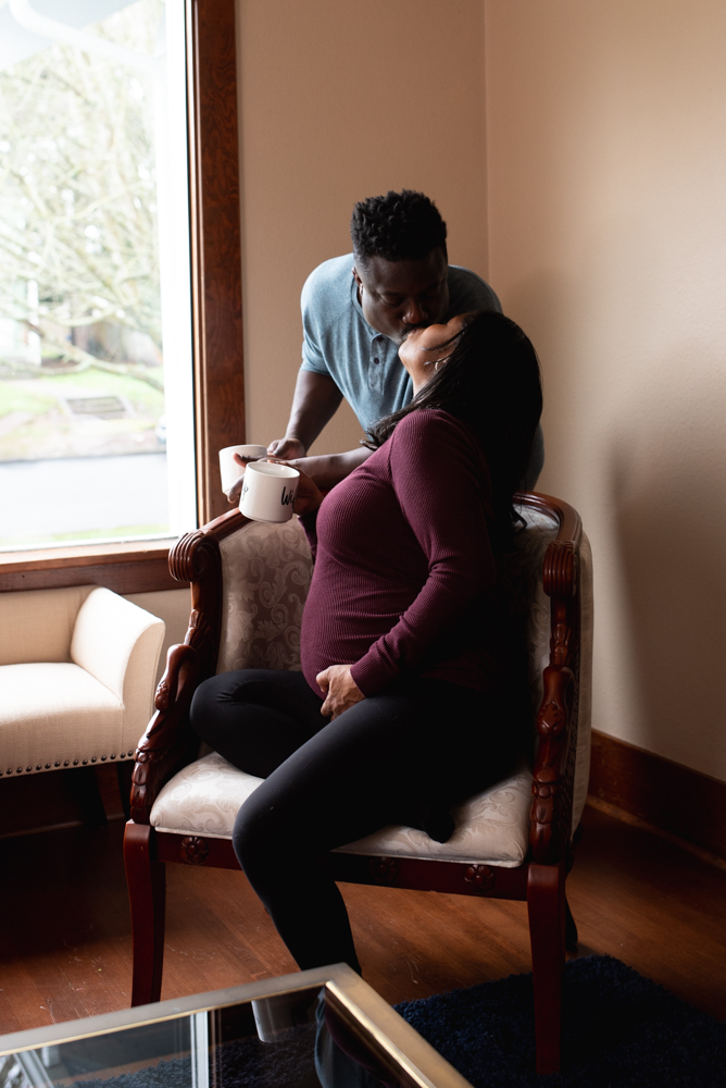 lifestyle maternity photo at home in Tacoma, couple drinking coffee together
